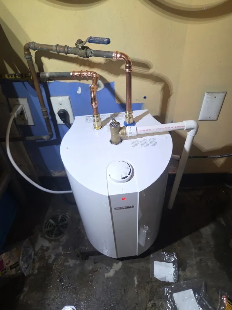 Small point of use electric water heater installed with new copper supply piping by Fullerton
