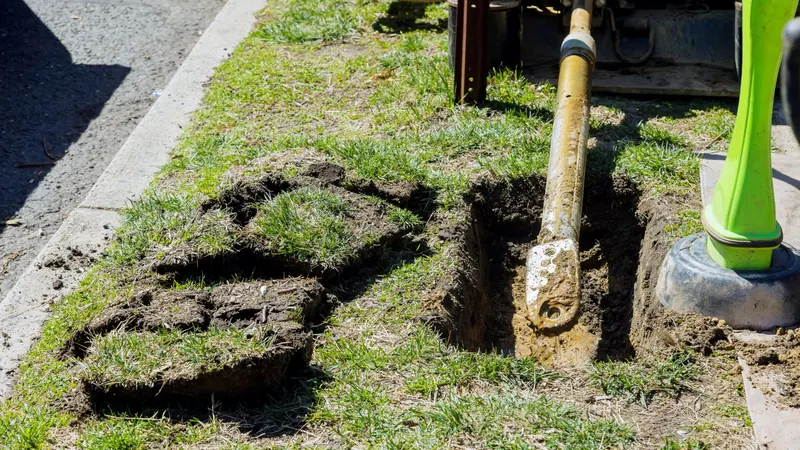 Trenchless sewer line replacement access point with minimal digging in a lawn