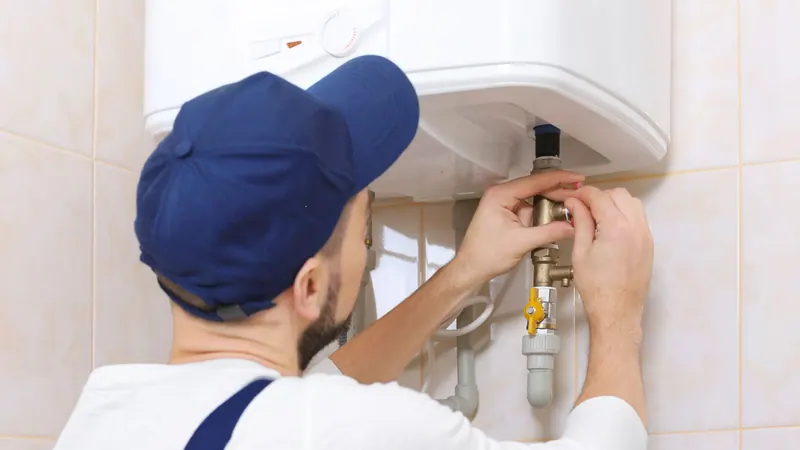 Fullerton technician installing a water heater